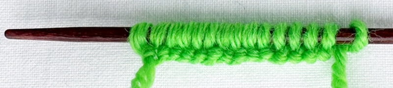 Blog-Inhaltsbild für 'Stricken mit Kindern: Kinderleichte Puppenmode für Strickanfänger'