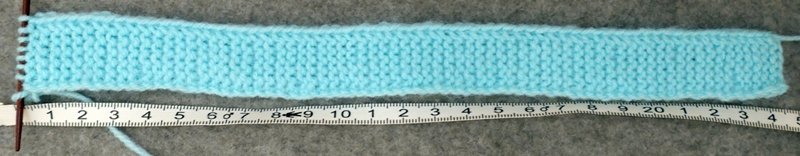 Blog-Inhaltsbild für 'Schal und Mütze für kleine Modepuppen - Kostenlose Strickanleitung'