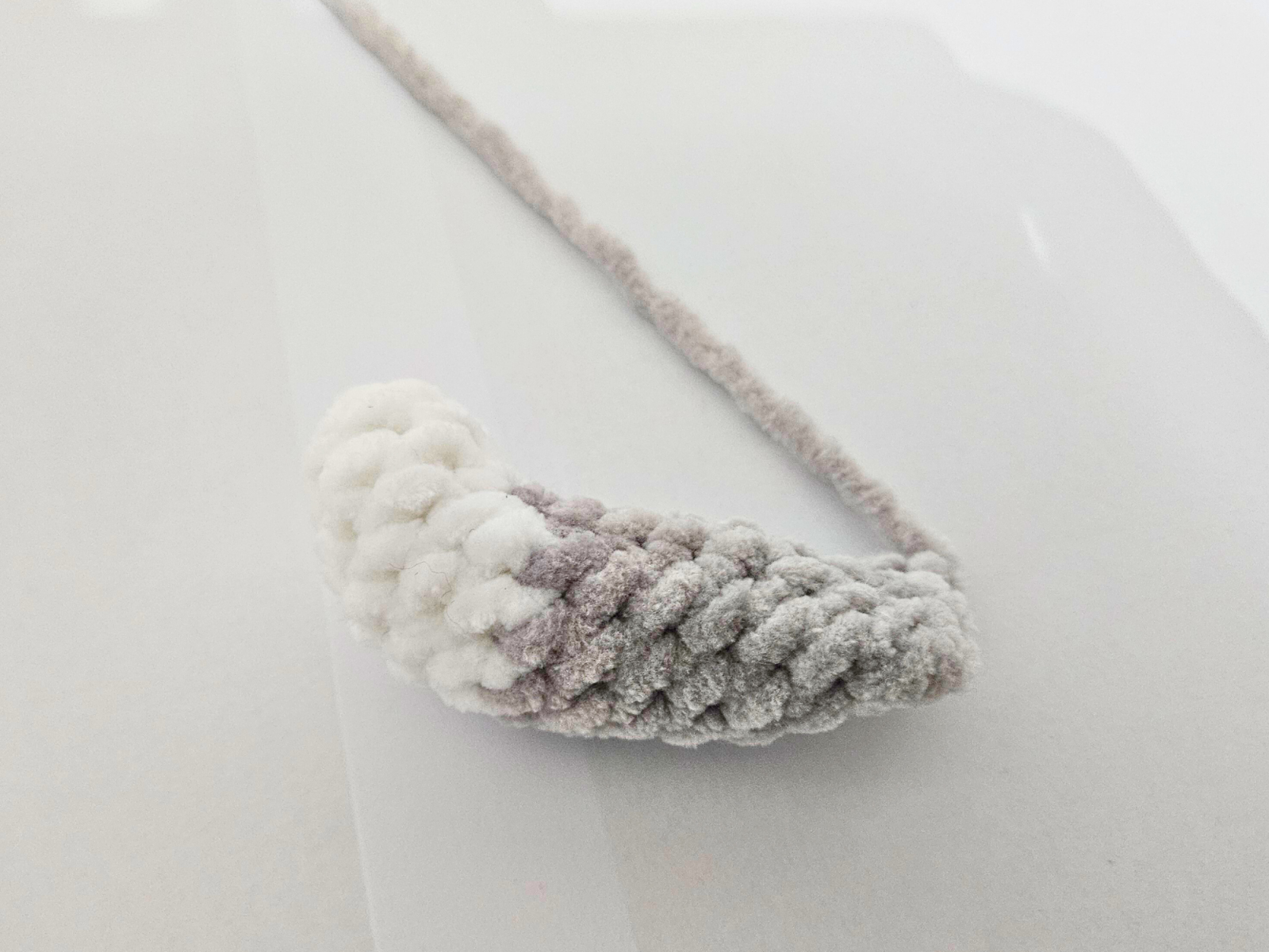 Blog content image for 'Free amigurumi crochet pattern for a small cat made with chenille yarn'