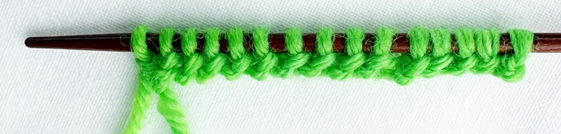 Blog-Inhaltsbild für 'Stricken mit Kindern: Kinderleichte Puppenmode für Strickanfänger'