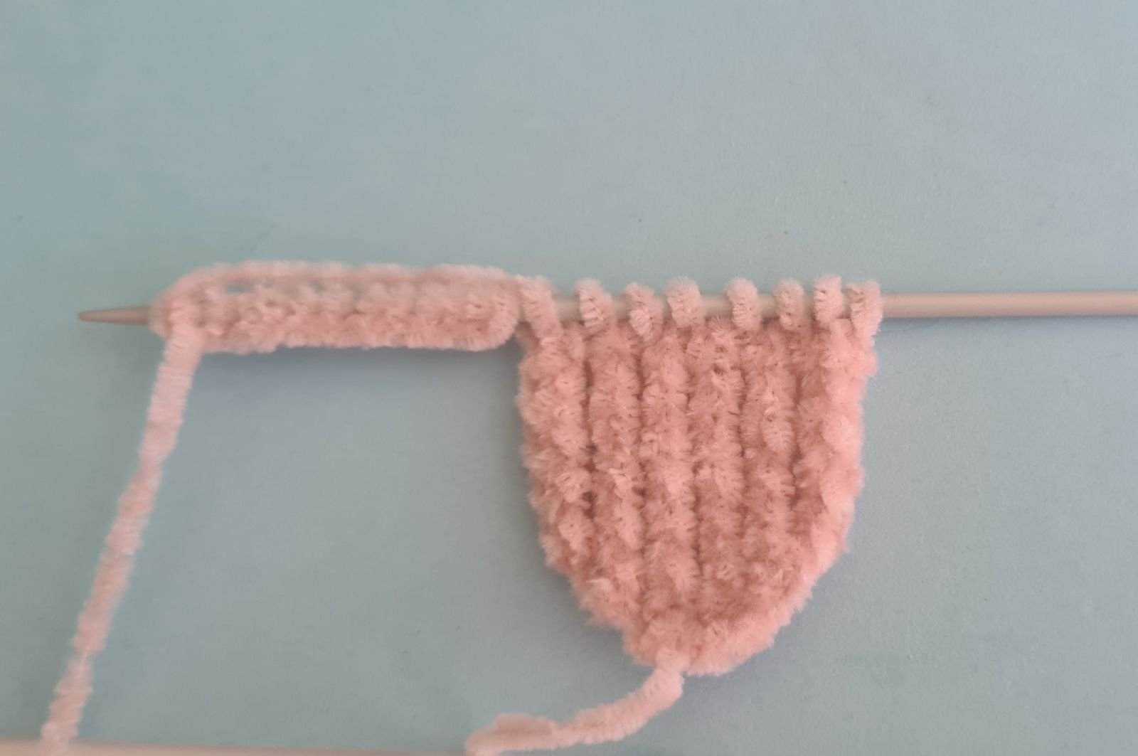 Blog content image for 'A fluffy little baby in a cozy deer, knitted.'