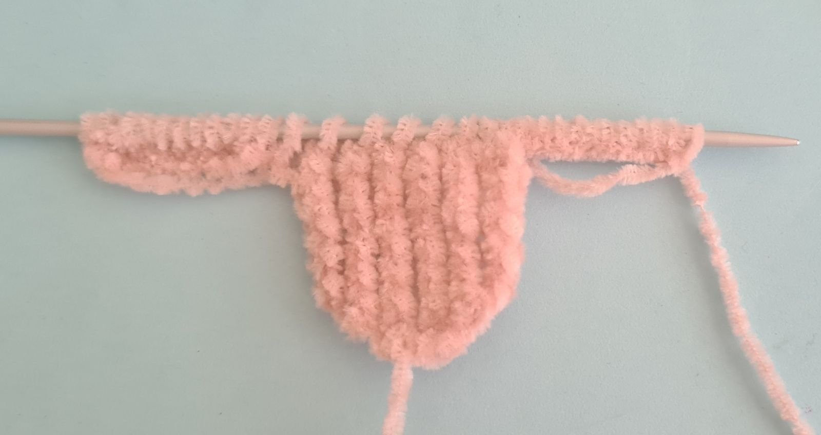Blog content image for 'A fluffy little baby in a cozy deer, knitted.'