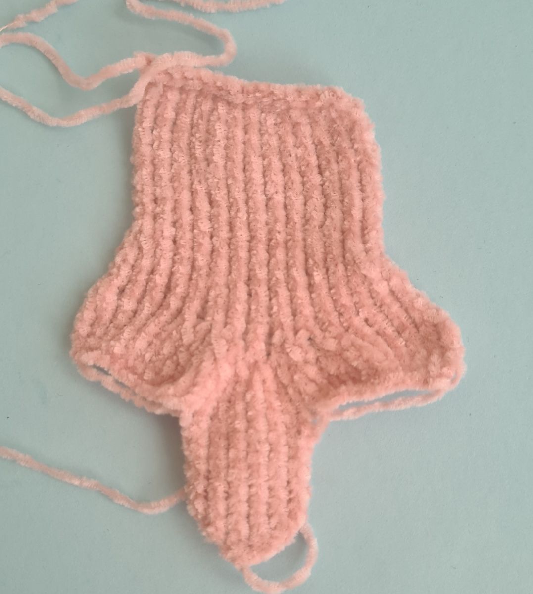 Blog content image for 'A fluffy little baby in a cozy deer, knitted.'