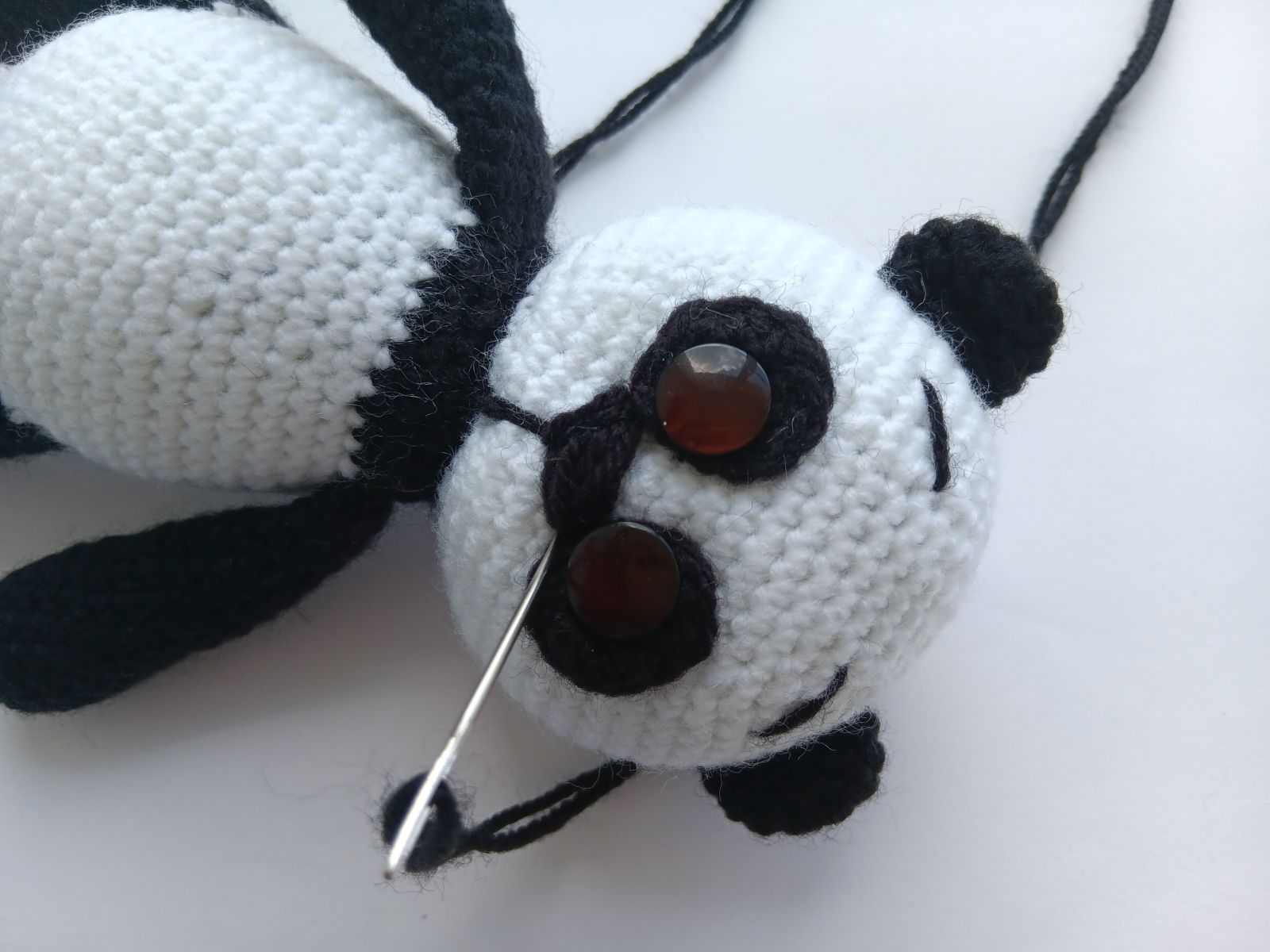 Blog-Inhaltsbild für 'Amigurumi Panda häkeln. Kostenlose Häkelanleitung'