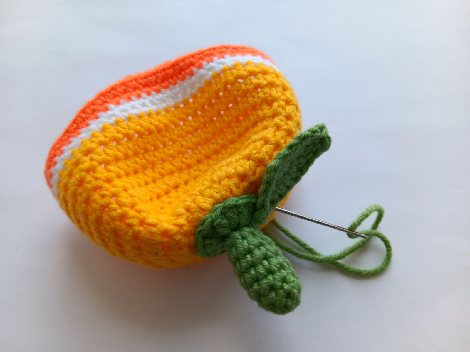 Blog-Inhaltsbild für 'Kostenlose Häkelanleitung für Puppe Orange'