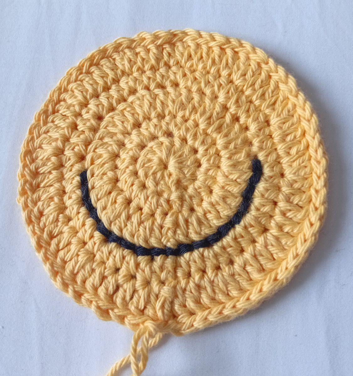 Blog-Inhaltsbild für 'Smiley häkeln: Happy or Sad? Kostenlose Anleitung für ein Emotion Türschild'