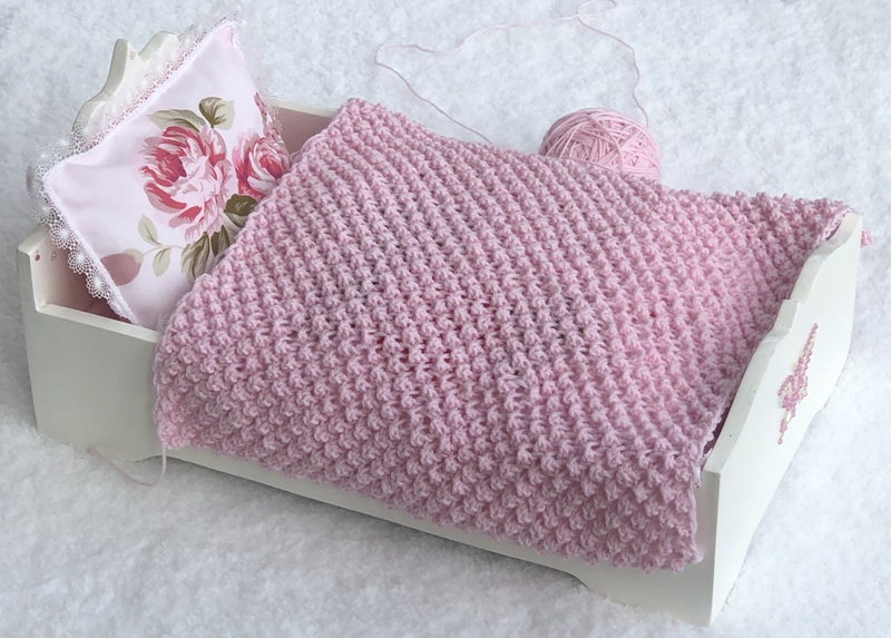 Blog-Inhaltsbild für 'Gratis Strickanleitung Decke im Röschenmuster'