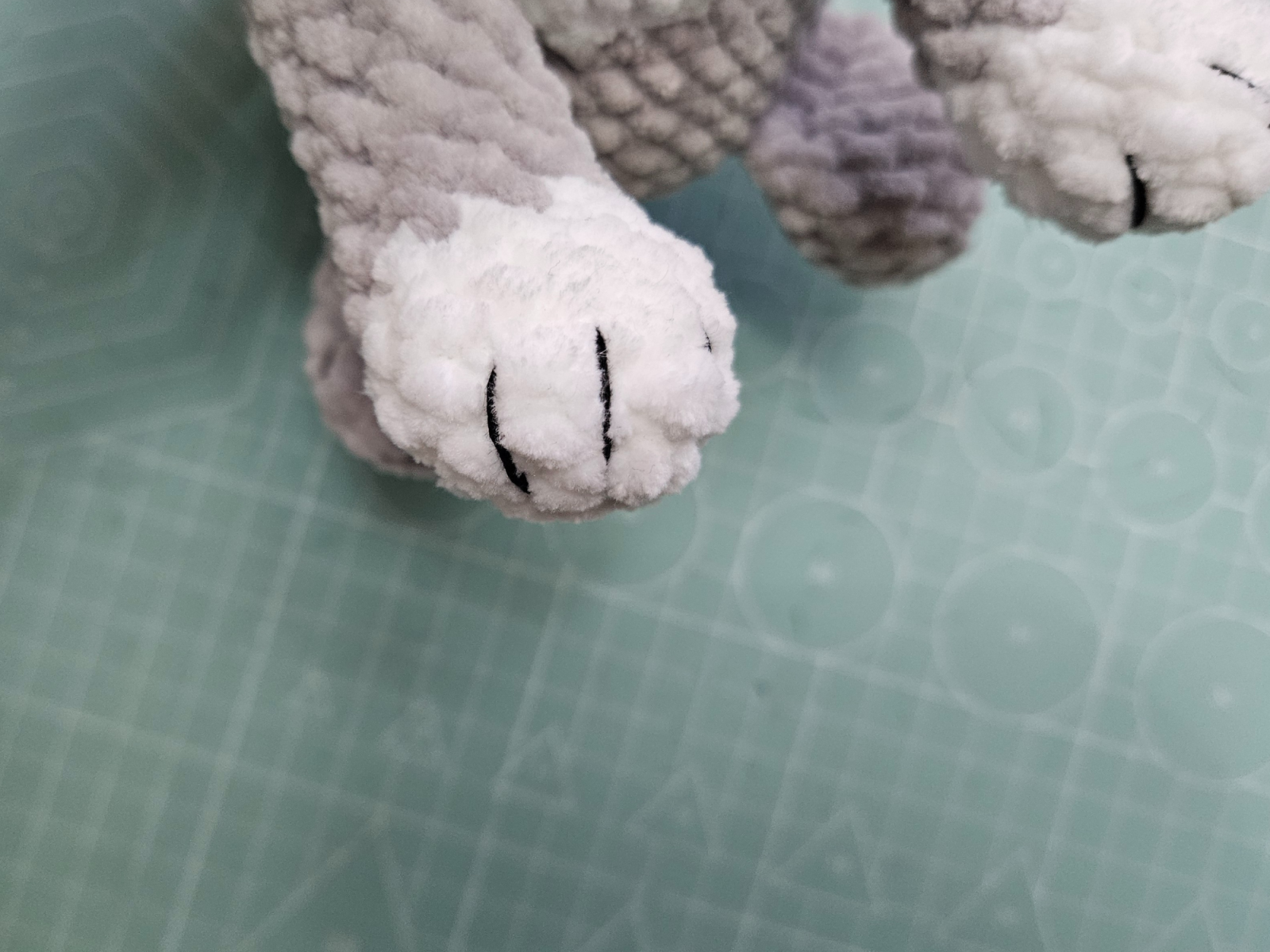 Blog content image for 'Free amigurumi crochet pattern for a small cat made with chenille yarn'