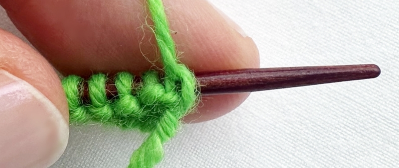 Blog-Inhaltsbild für 'Stricken mit Kindern: Kinderleichte Puppenmode für Strickanfänger'