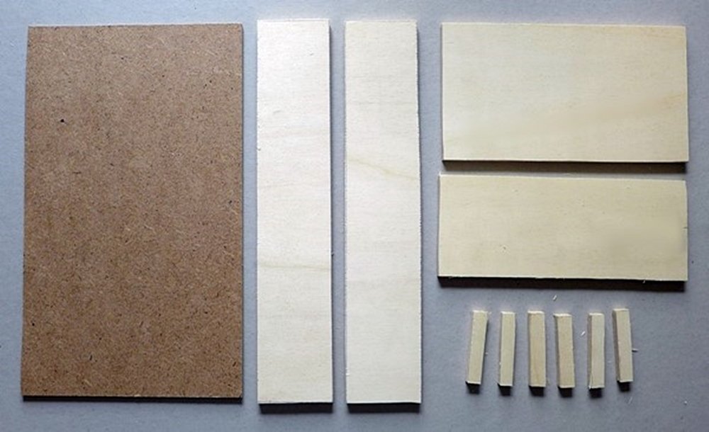 Blog-Inhaltsbild für 'Kreativ mit Holz: Wir bauen gemeinsam ein Puppenbett im Bauhausstil'