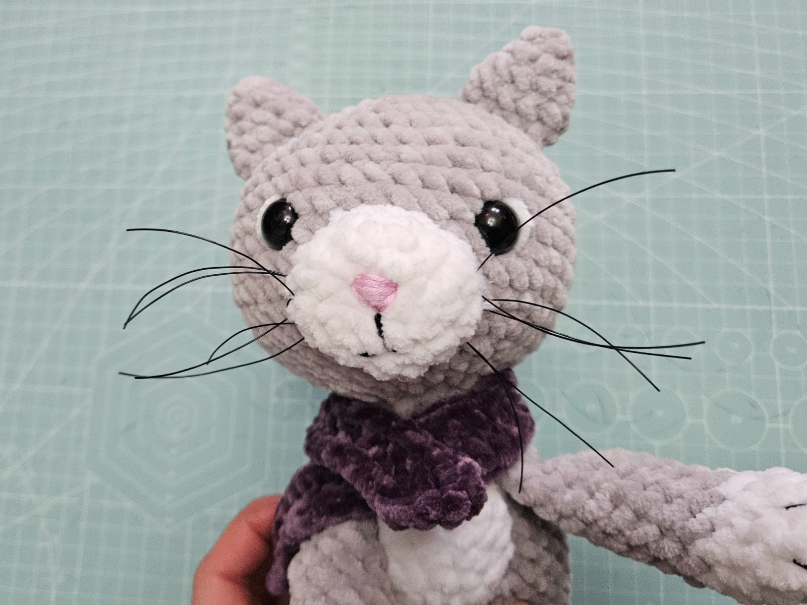 Blog content image for 'Free amigurumi crochet pattern for a small cat made with chenille yarn'