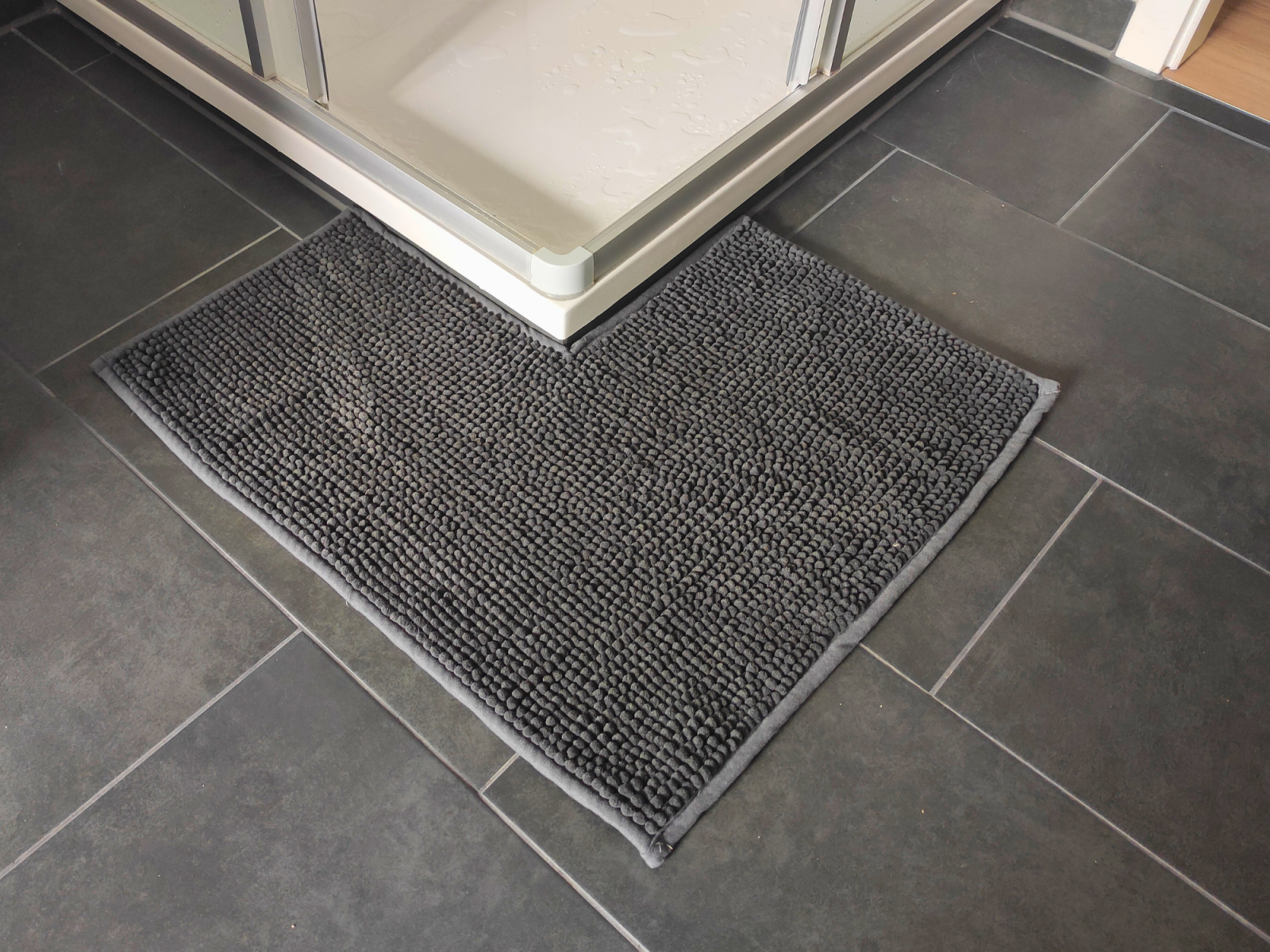 Blog content image for 'DIY: Turn a Regular Bath Mat into a V-Shaped Rug for Your Corner Shower'