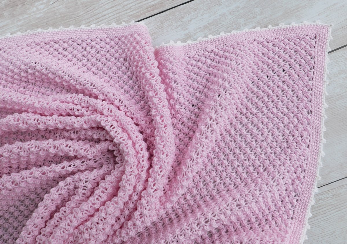 Blog-Inhaltsbild für 'Gratis Strickanleitung Decke im Röschenmuster'