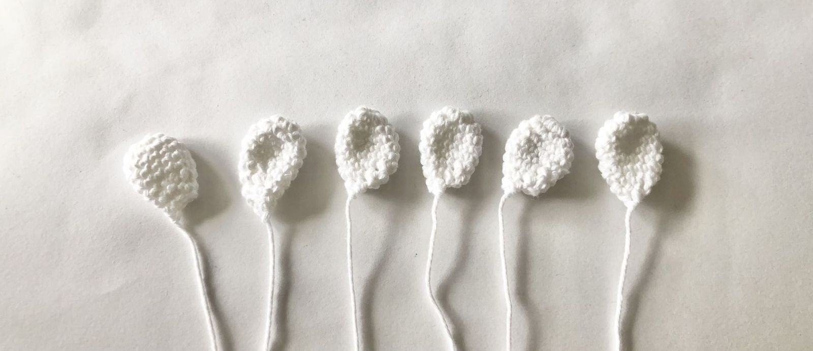 Blog-Inhaltsbild für 'Häkelanleitung Kranz Raupe'