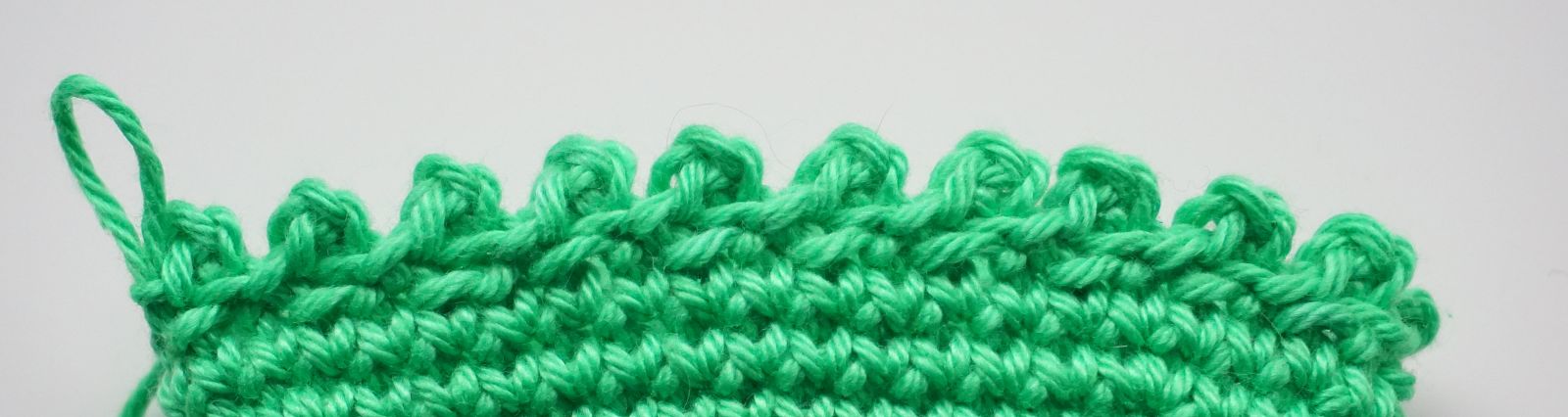 Blog-Inhaltsbild für 'Häkelanleitung Eierwärmer Tannenbäumchen - Freebie'