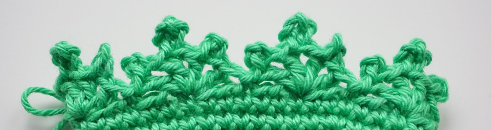 Blog-Inhaltsbild für 'Häkelanleitung Eierwärmer Tannenbäumchen - Freebie'