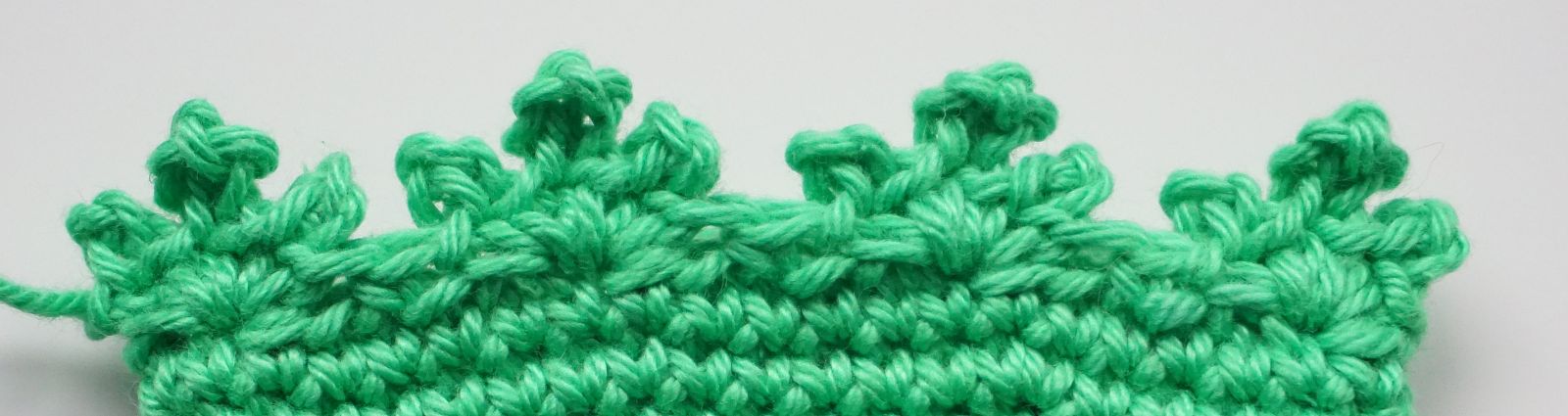 Blog-Inhaltsbild für 'Häkelanleitung Eierwärmer Tannenbäumchen - Freebie'