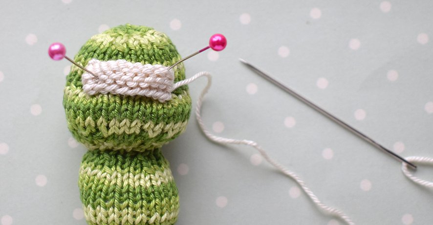 Blog-Inhaltsbild für 'Gestrickter Magnet „Apfel mit Wurm“'