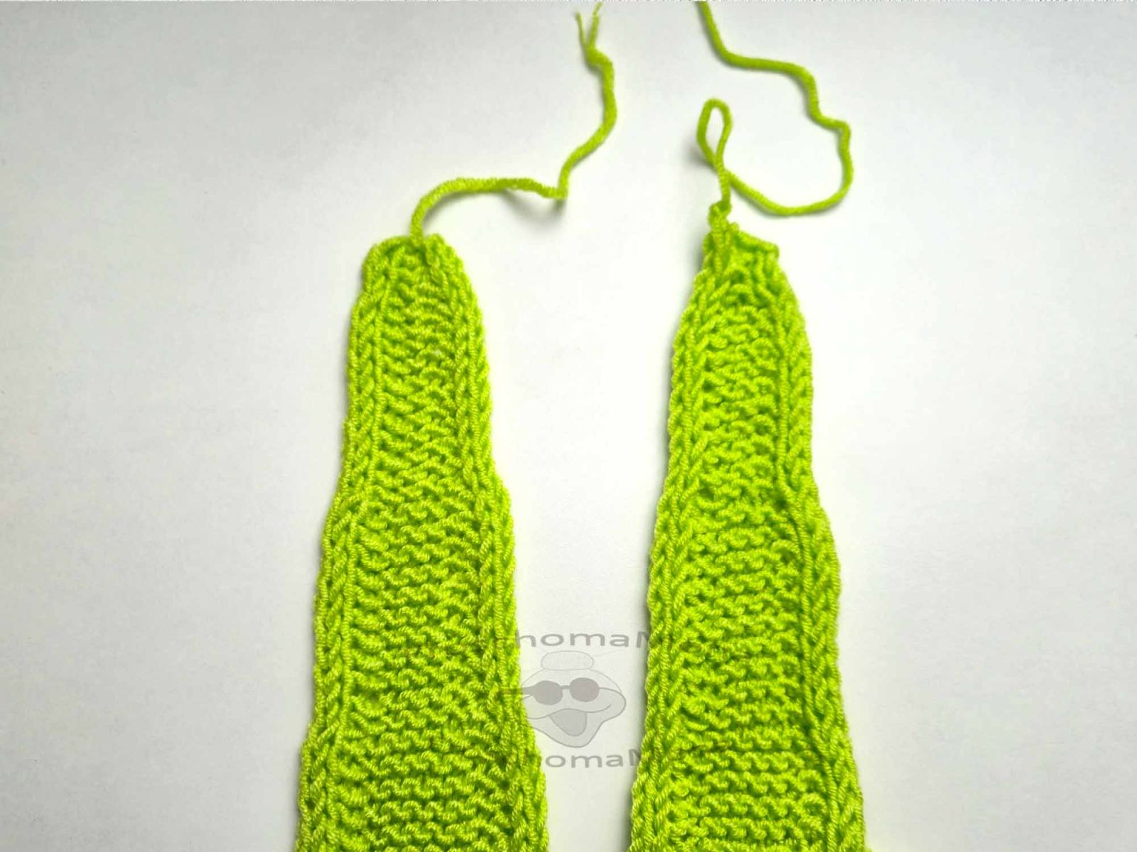 Das Bild zeigt die beiden Tuchspitzen bevor die Fäden vernäht wurden.