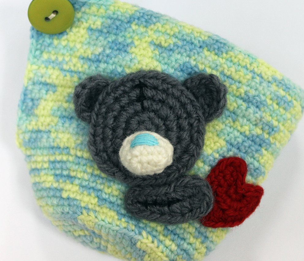 Blog-Inhaltsbild für 'Gehäkelter Tassenwärmer mit Teddybären'