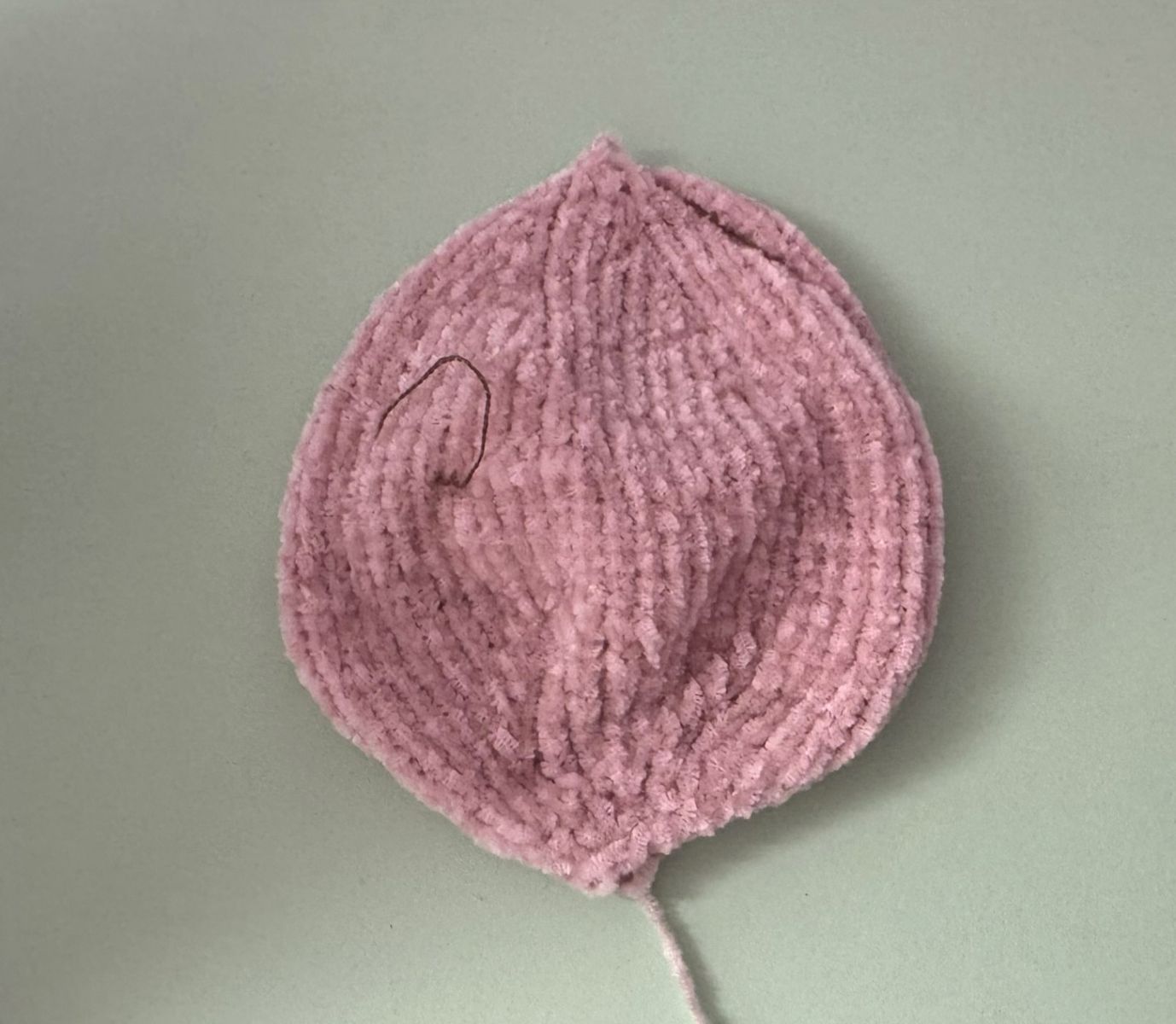 Blog content image for 'A fluffy little baby in a cozy deer, knitted.'