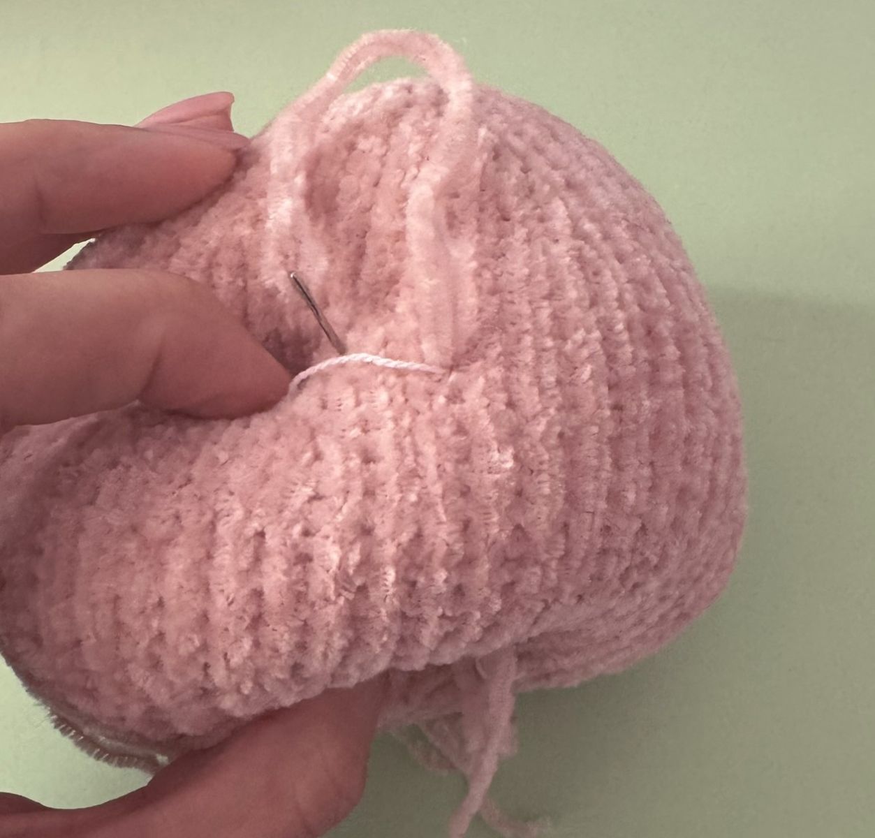 Blog content image for 'A fluffy little baby in a cozy deer, knitted.'