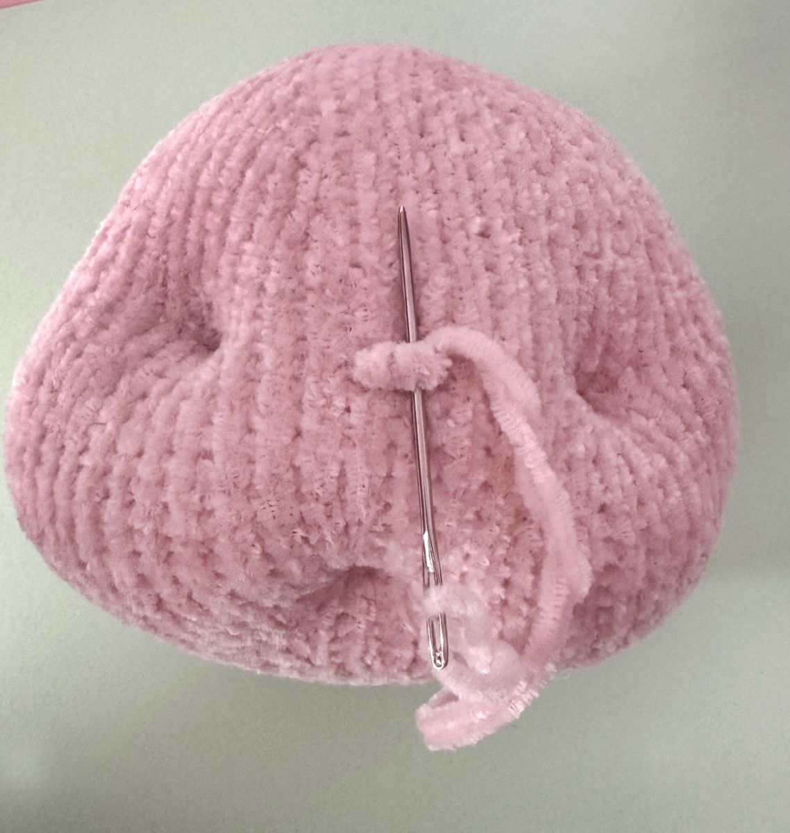 Blog content image for 'A fluffy little baby in a cozy deer, knitted.'