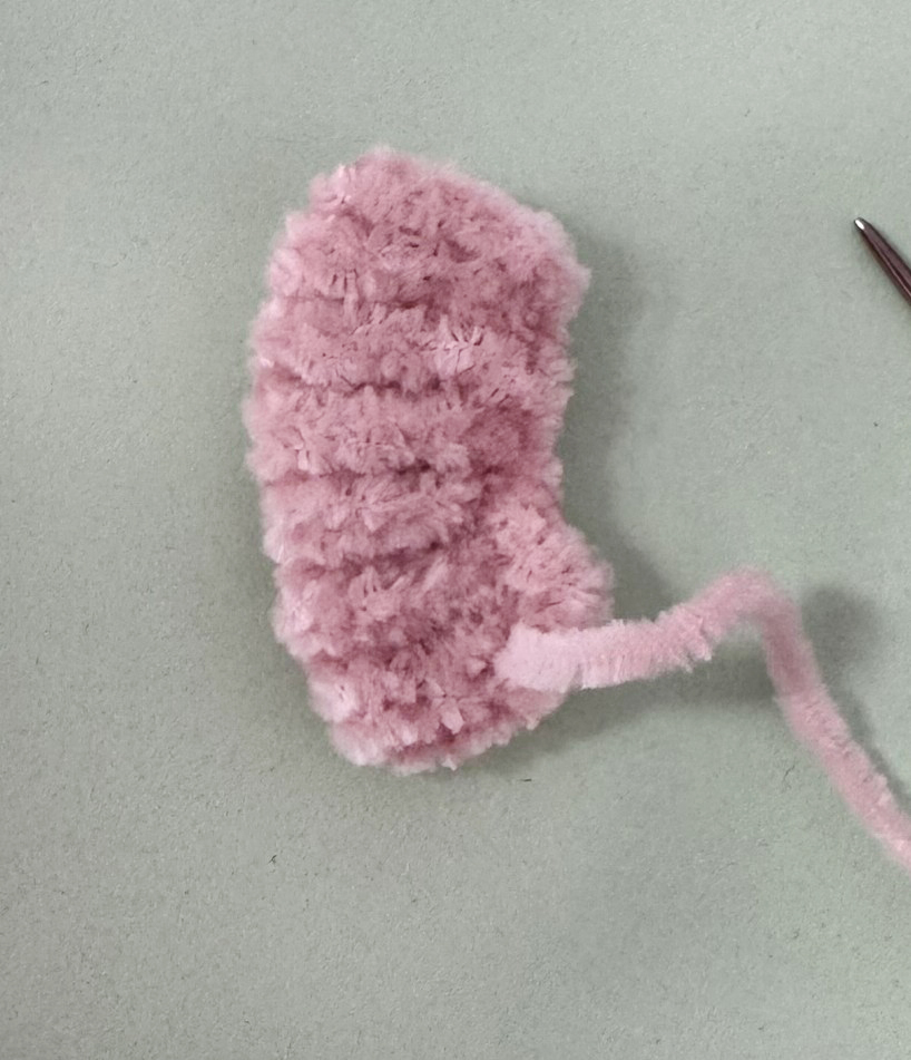 Blog content image for 'A fluffy little baby in a cozy deer, knitted.'