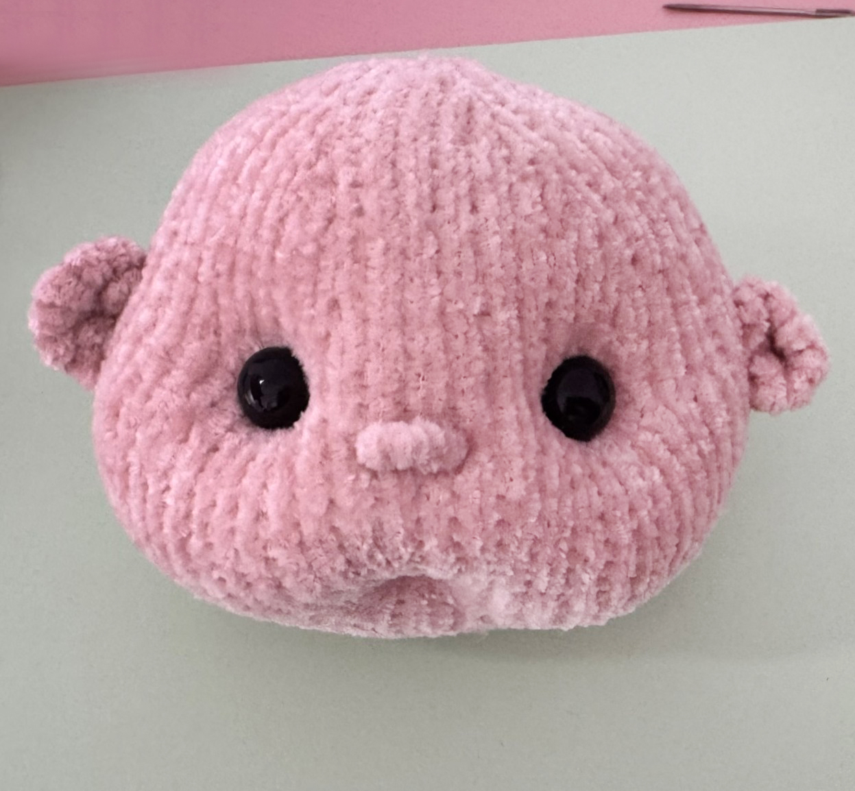 Blog content image for 'A fluffy little baby in a cozy deer, knitted.'