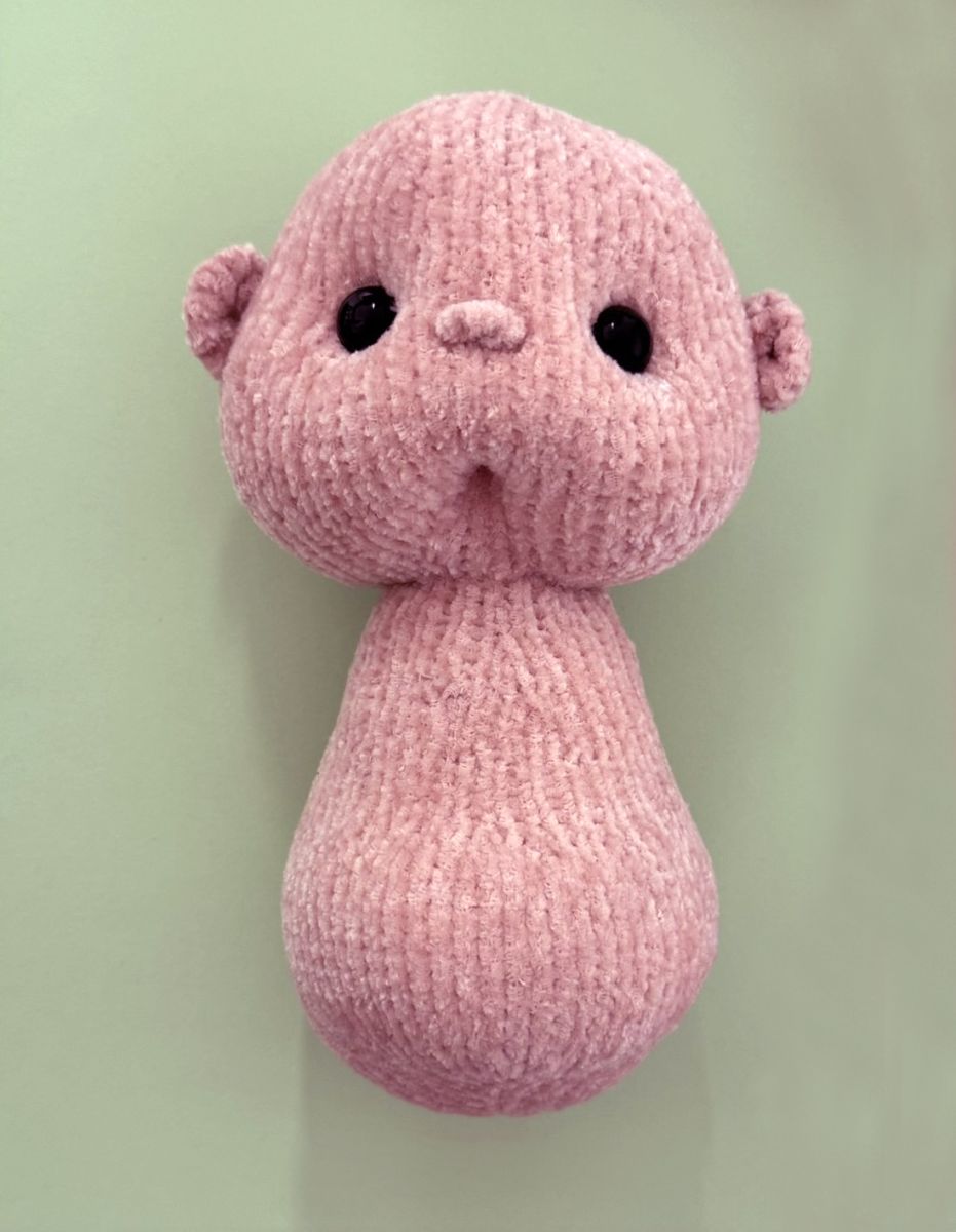 Blog content image for 'A fluffy little baby in a cozy deer, knitted.'