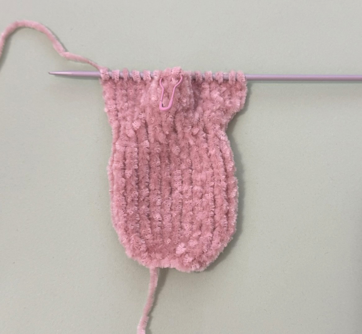 Blog content image for 'A fluffy little baby in a cozy deer, knitted.'