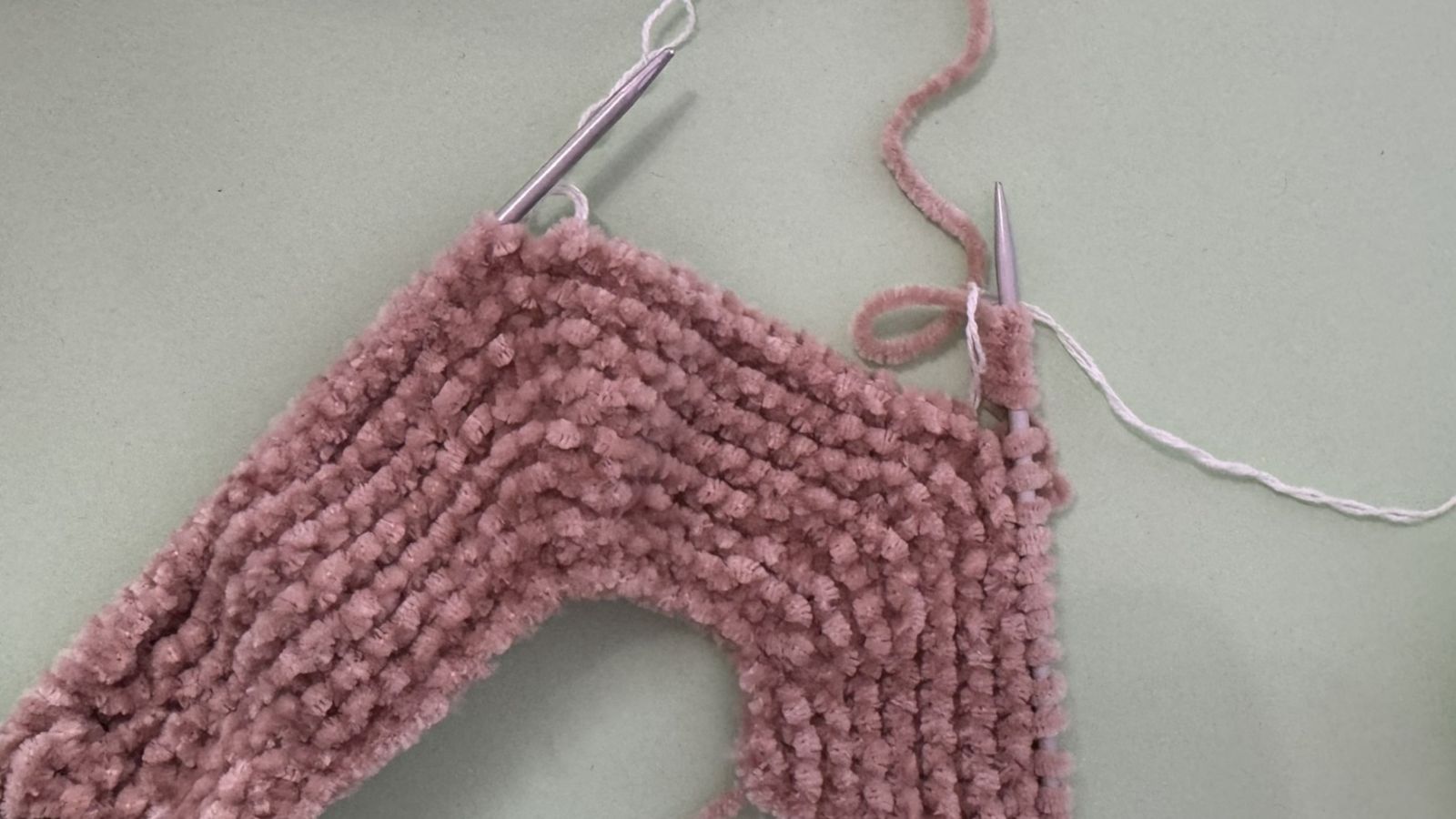 Blog content image for 'A fluffy little baby in a cozy deer, knitted.'