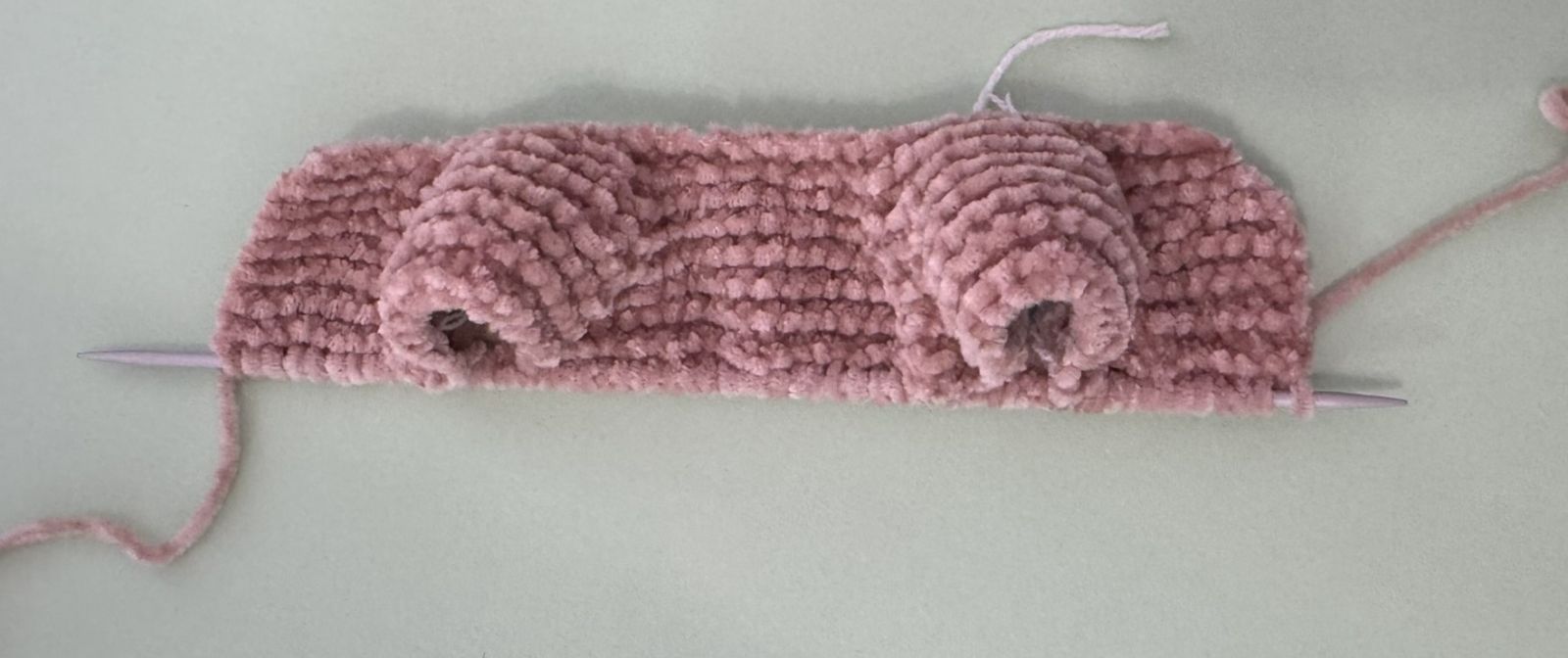 Blog content image for 'A fluffy little baby in a cozy deer, knitted.'