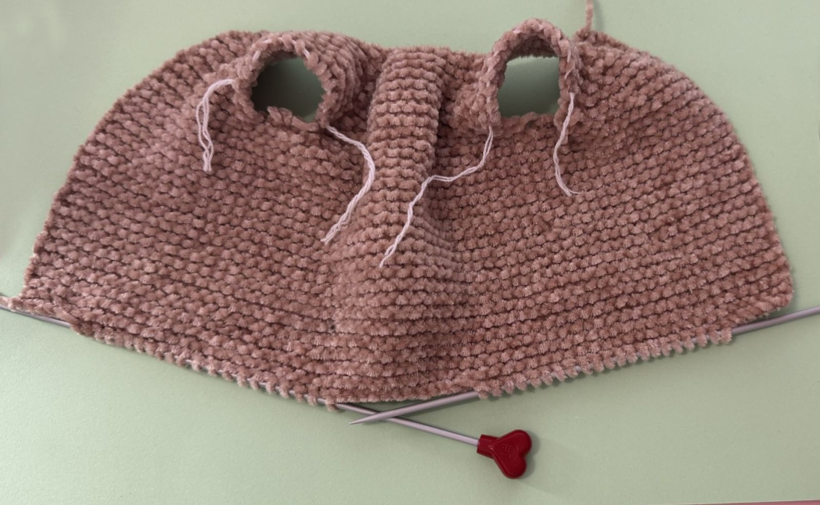 Blog content image for 'A fluffy little baby in a cozy deer, knitted.'