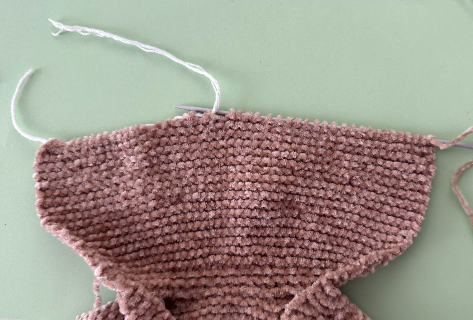 Blog content image for 'A fluffy little baby in a cozy deer, knitted.'