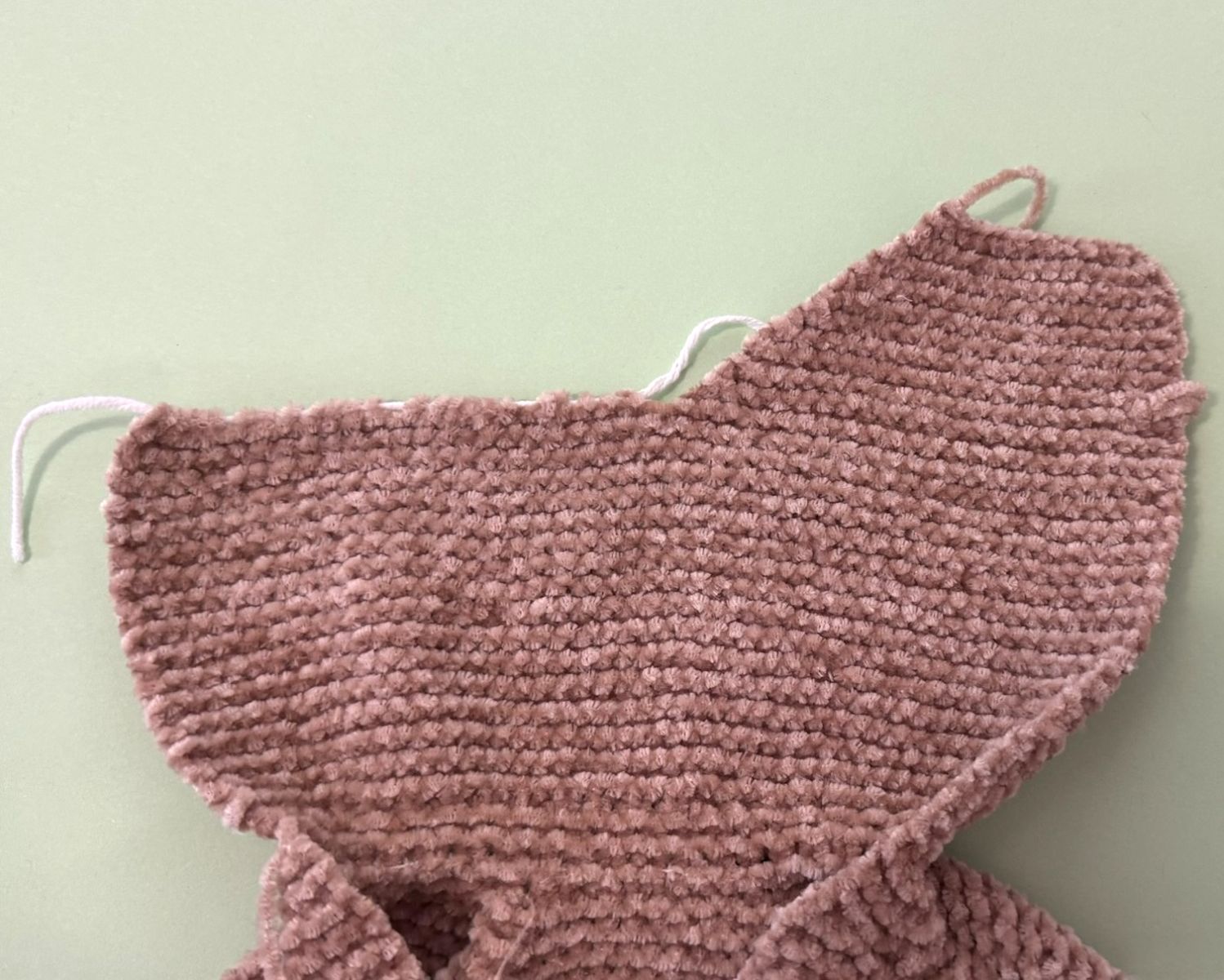 Blog content image for 'A fluffy little baby in a cozy deer, knitted.'