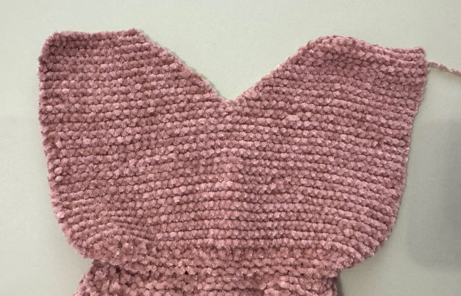 Blog content image for 'A fluffy little baby in a cozy deer, knitted.'