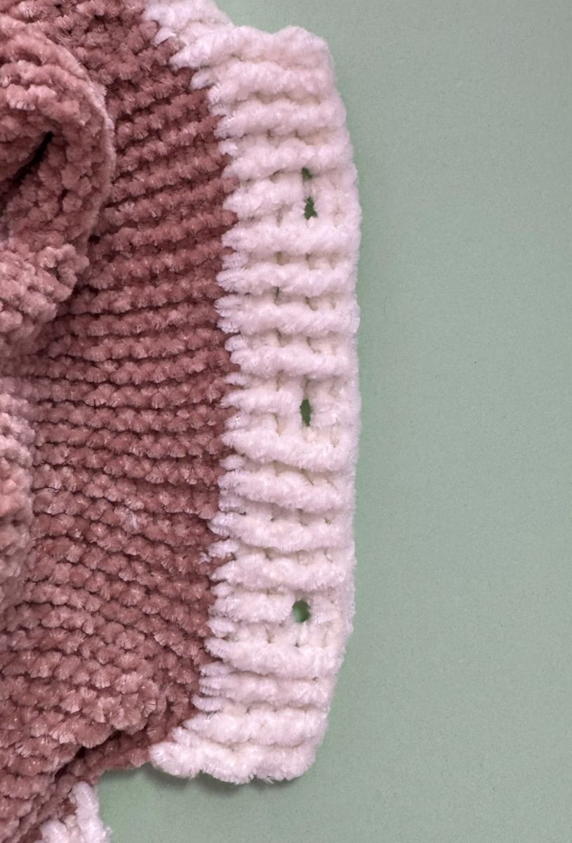 Blog content image for 'A fluffy little baby in a cozy deer, knitted.'