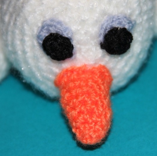 Blog-Inhaltsbild für 'Kostenlose Häkelanleitung - Kleiner Schneemann mit seinem Kuschelstern'