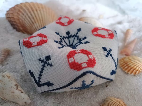 How to embroider and finish a biscornu, including a free cross-stitch pattern for a biscornu with maritime motifs