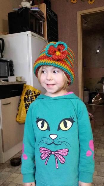 Ein xxl Stiefmütterchen  auf die Mütze