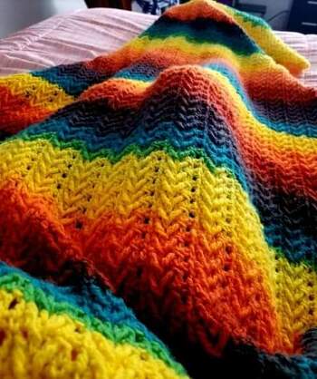 Front post granny blanket using scrap yarn and a 3.75 mm hook. I use a smaller hook than indicated because I tend to crochet loosely.