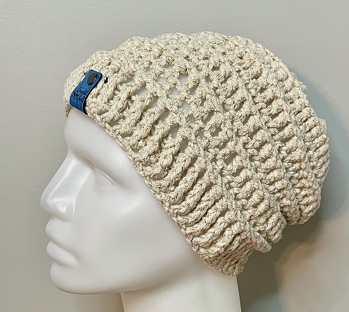 My Boogie Nights Slouch Hat. I purchased a Santa Sack from Lion Brand yarn and it had a few skiens of Boogie Nights yarn in it in the color birdcage. I made 2 of these hats. Gave one as a gift and the other was put in my online shop and just sold. It is a chunky yarn. More of between a 4 & 5 if you ask me. I do like this color. You don’t see the gold metallic much.