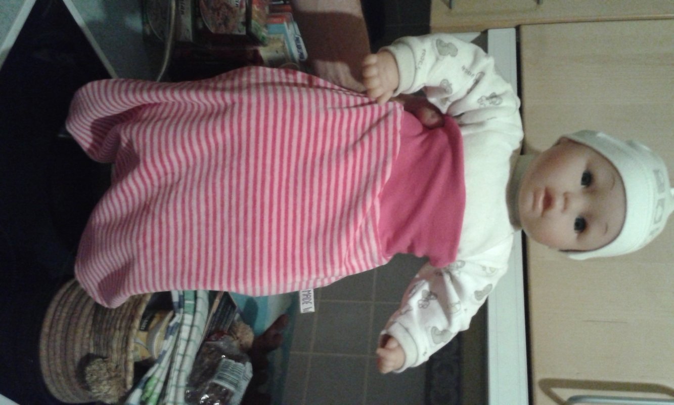 Pucksack und Erstlingsmütze