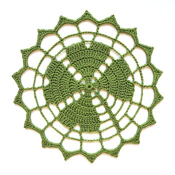 I'm very pleased with my lucky clover doily. Blocking it gave a good finishing touch.