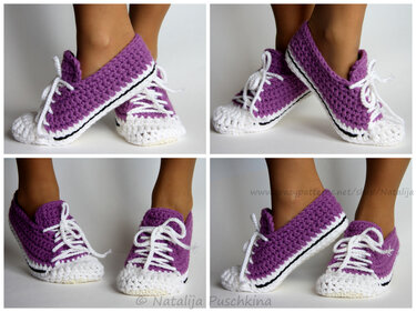 Purple and white crocheted sneaker-style slippers worn on feet.