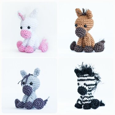 Vier sitzende Amigurumi-Tiere: Einhorn, Pferd, Esel und Zebra, gehäkelt.