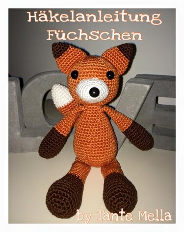 Gehäkeltes Amigurumi-Füchschen in Orange, Braun und Weiß