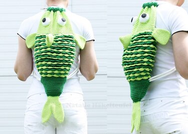 Person wearing a green two-tone crochet fish backpack with layered scalloped scales and white rope drawstring straps