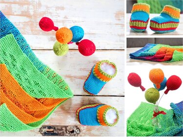 Bunte gestrickte Babydecke mit einem Paar Babyschuhen und mehreren gestrickten Kugeln auf hellem Holzhintergrund